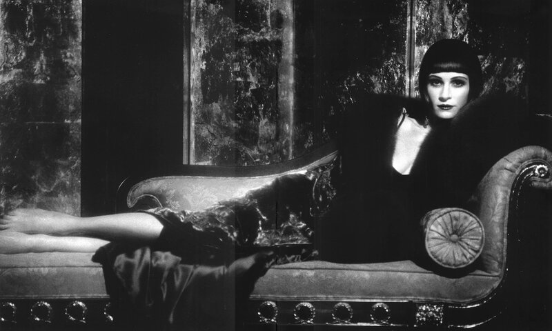 woman in vintage dress on chaise lounge