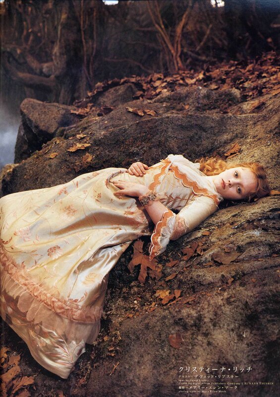 Woman in vintage dress on rocks