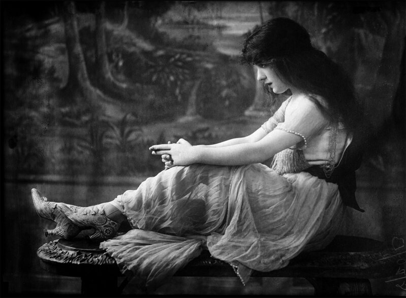woman in vintage dress sitting