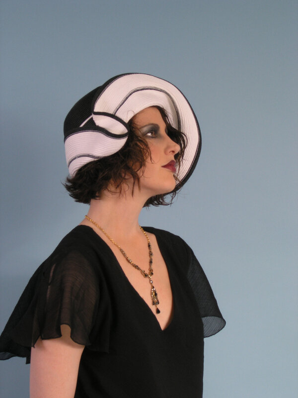 woman in vintage hat and black dress