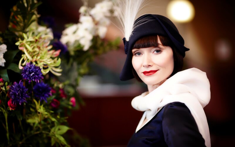 woman in vintage hat with flowers