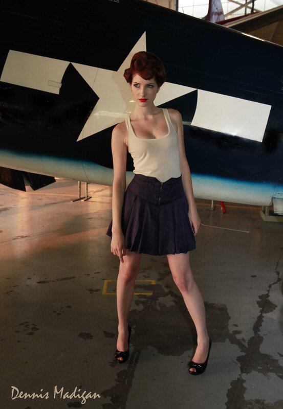 Woman in vintage outfit near airplane