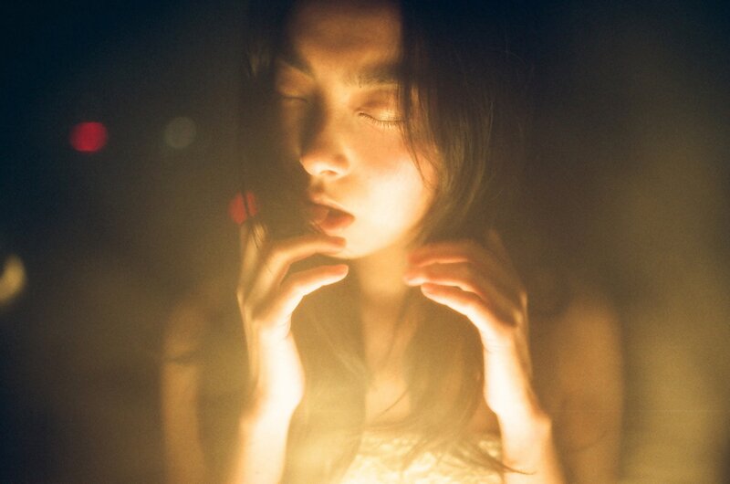 woman in warm light at night