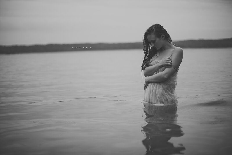 woman in water at dusk