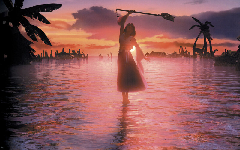 woman in water at sunset