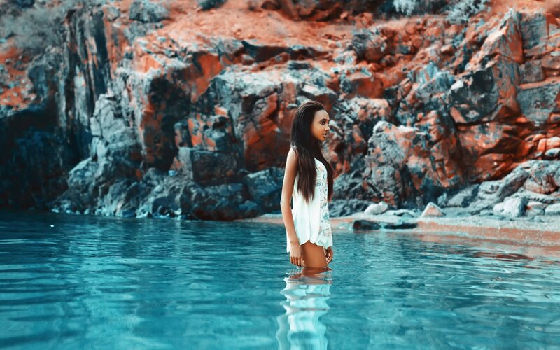 Woman in Water — Blue, Serene, Afternoon, Photograph, Rocks