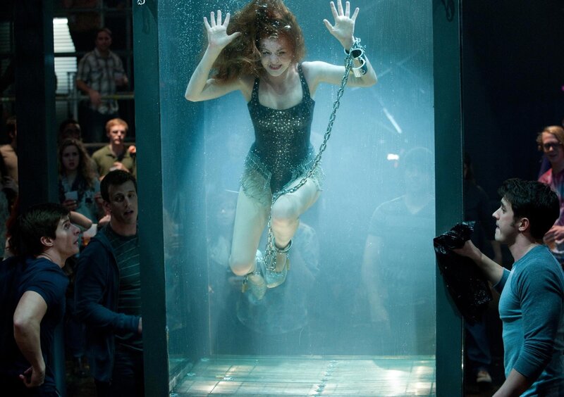 Woman in water tank performance