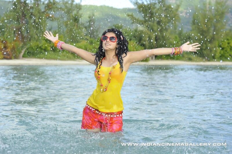 woman in water with arms outstretched