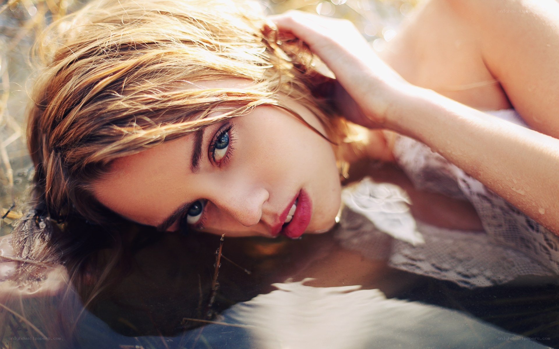 woman in water with blue eyes