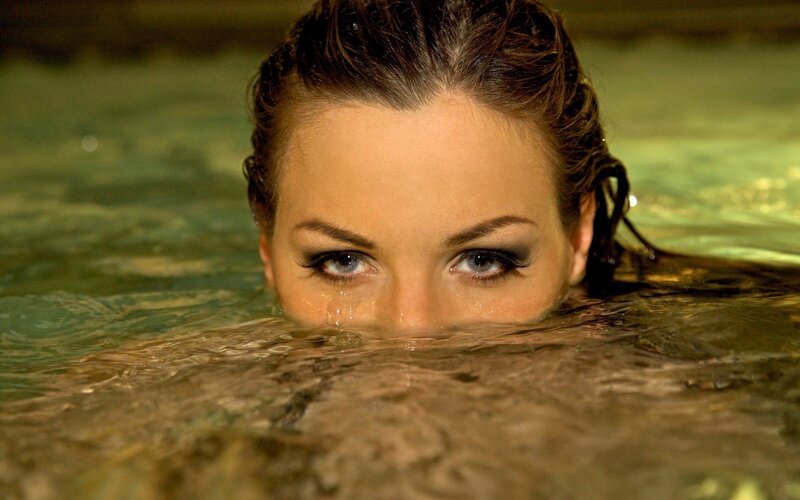 woman in water with eyes visible