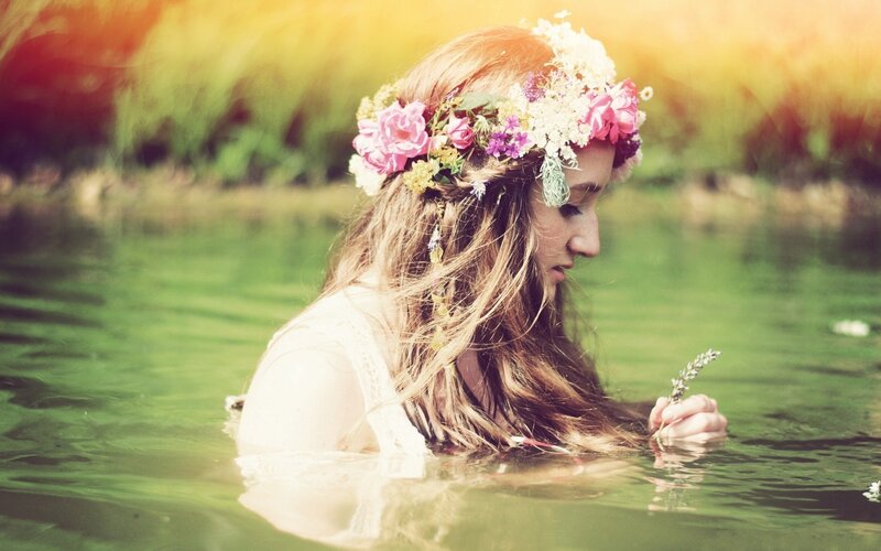 woman in water with flower crown