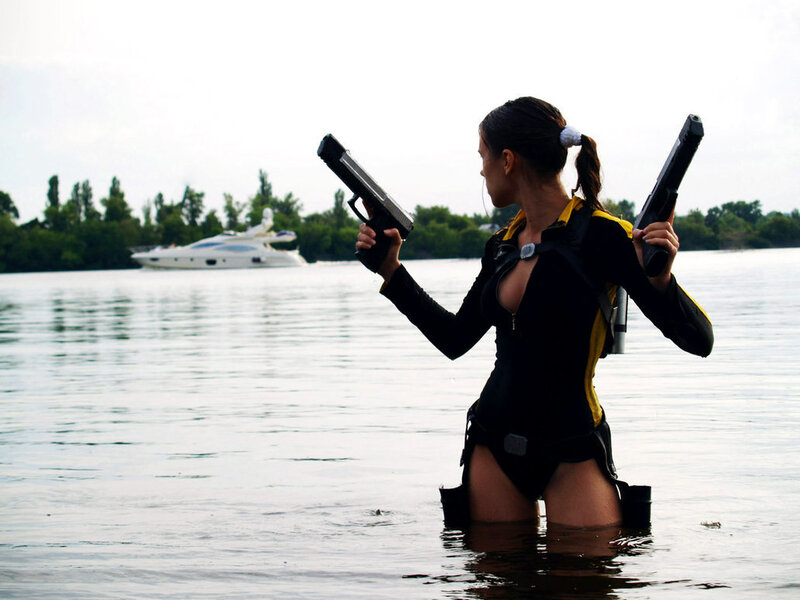 woman in water with guns