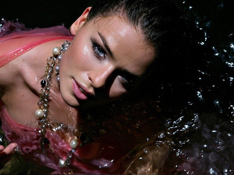 woman in water with pearls