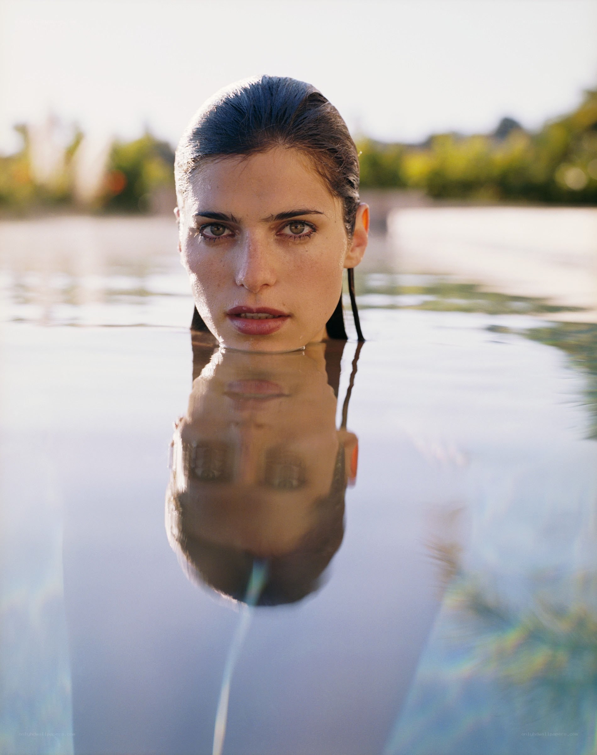 woman in water with reflection