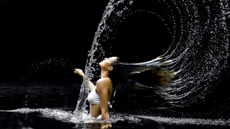 woman in water with splashing spray