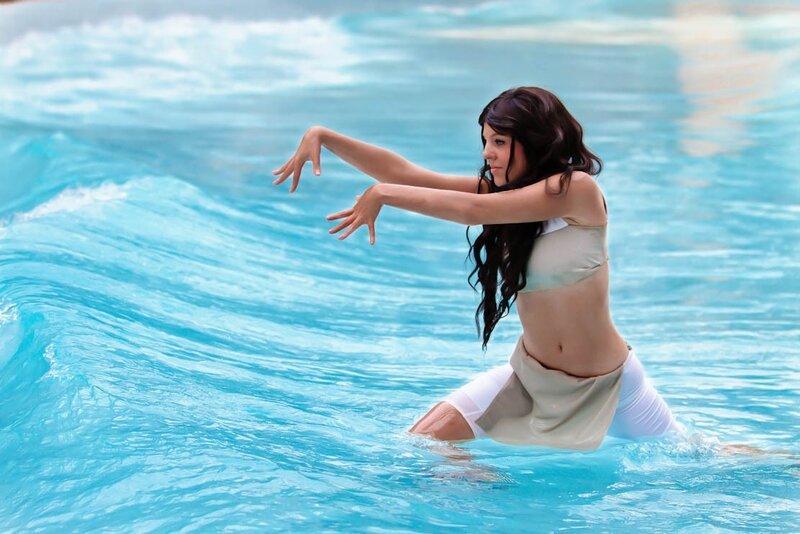 woman in water with wave