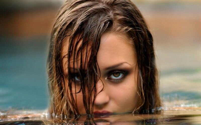 woman in water with wet hair