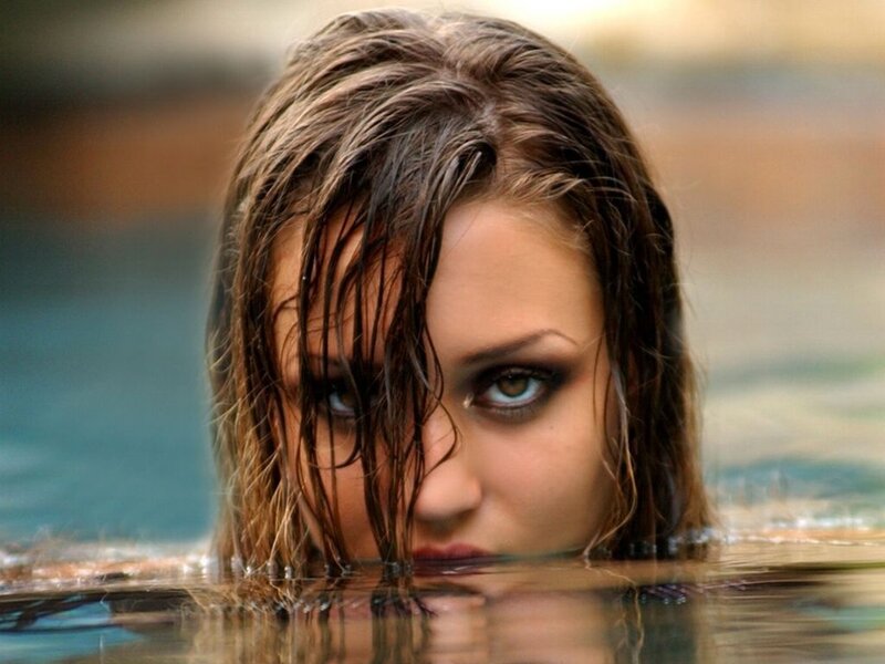 woman in water with wet hair