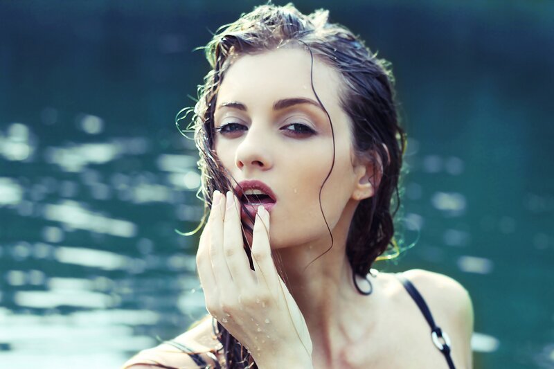 woman in water with wet hair