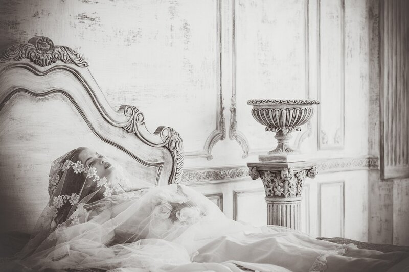 Woman in Wedding Dress — Black, Dramatic, Photograph, Bed