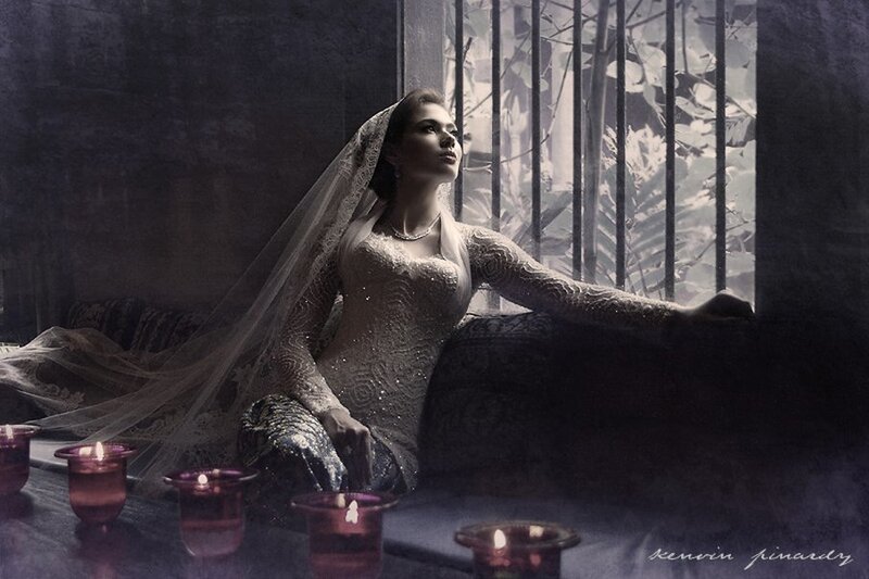 woman in wedding dress by window