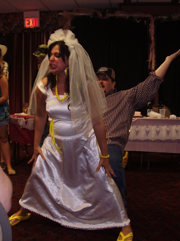 Woman in wedding dress dancing