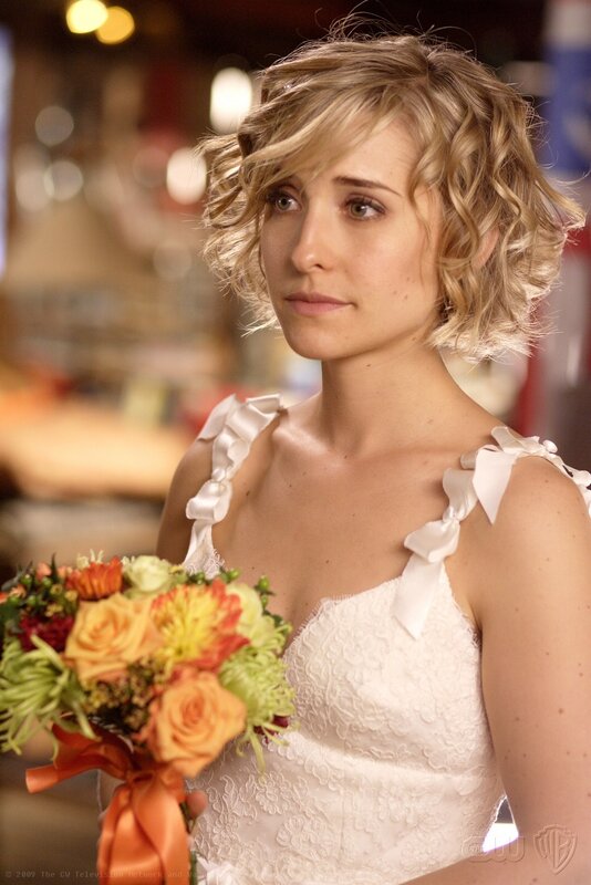 woman in wedding dress holding bouquet