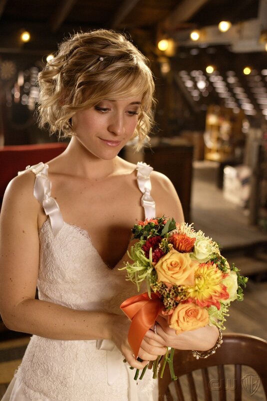 woman in wedding dress holding bouquet