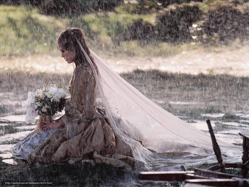 woman in wedding dress in rain