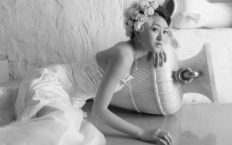 woman in wedding dress lying