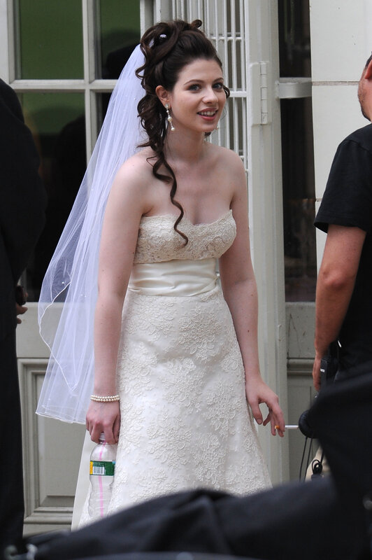 woman in wedding dress on set