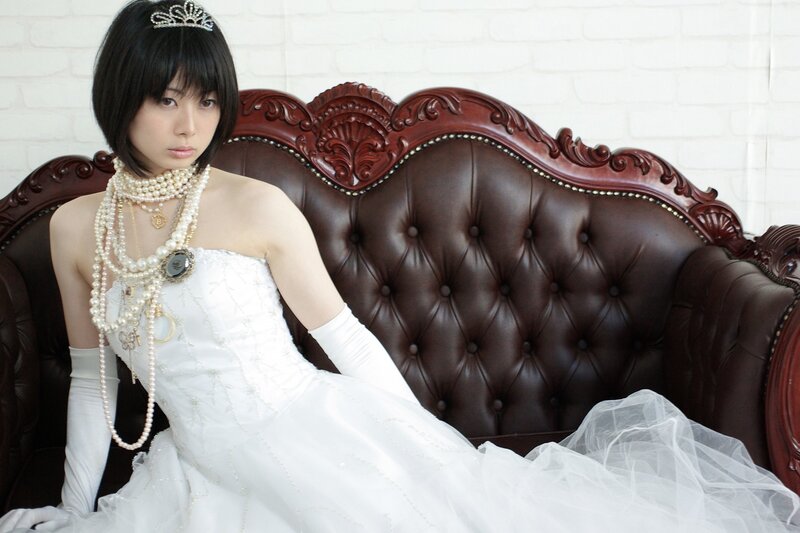 woman in wedding dress on sofa