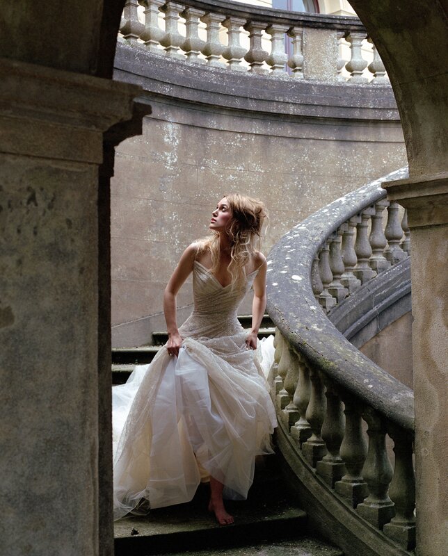 Woman in wedding dress on stairs