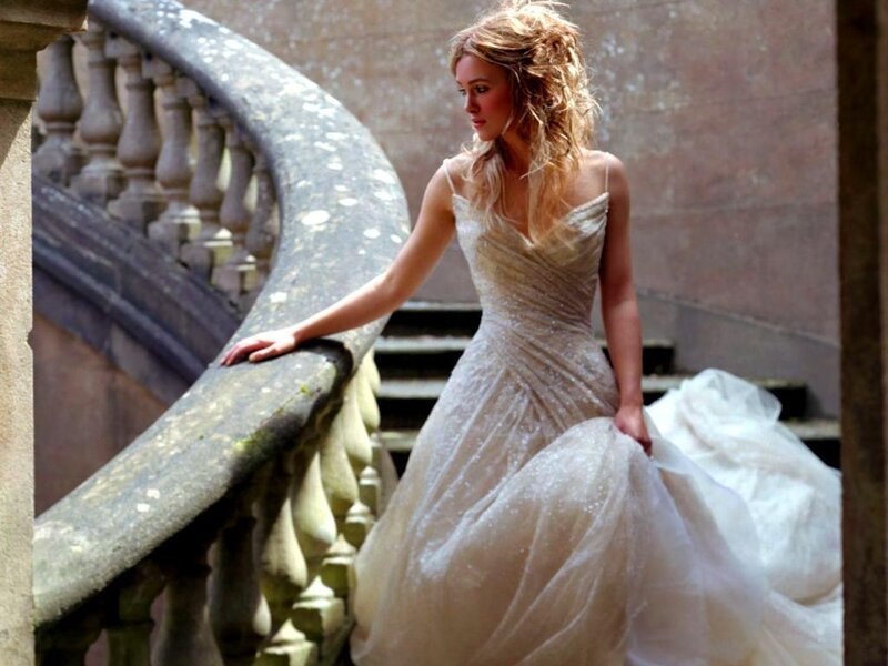 woman in wedding dress on stairs