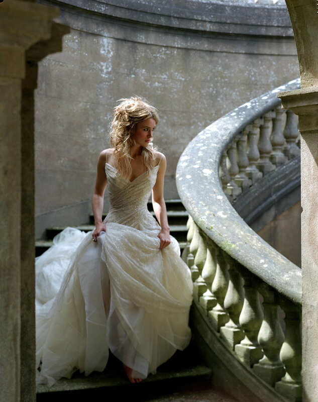 woman in wedding dress on stairs