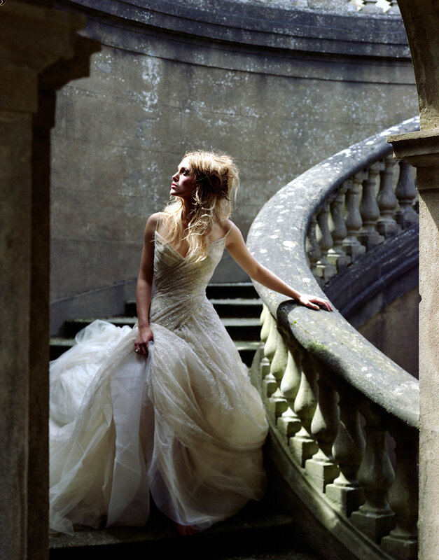 woman in wedding dress on stairs