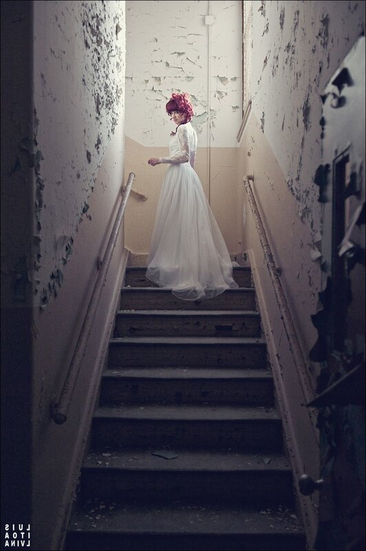 Woman in wedding dress on stairs