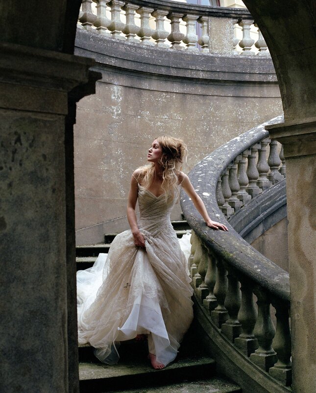 woman in wedding dress on stairs