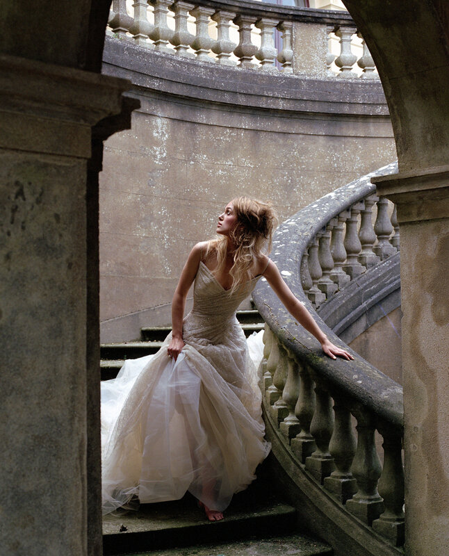Woman in wedding dress on stairs