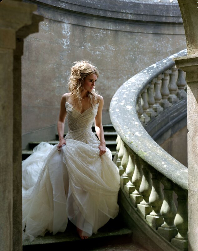 woman in wedding dress on stairs