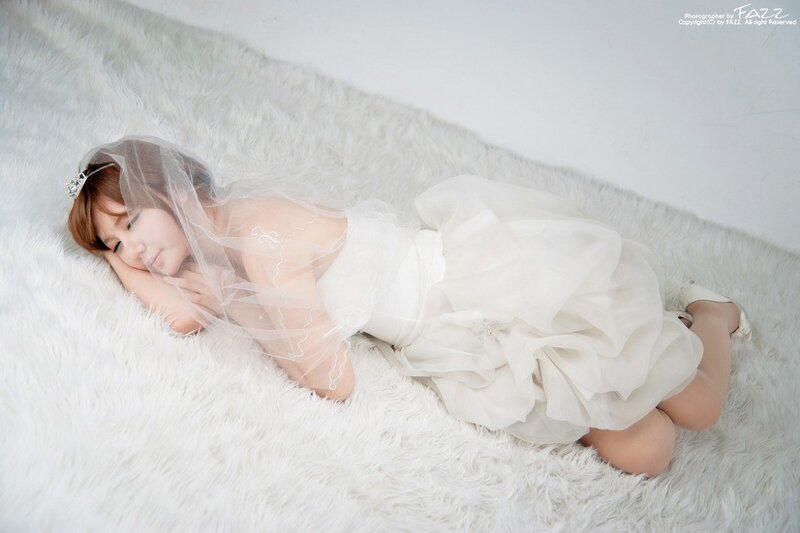 woman in wedding dress sleeping
