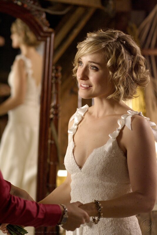 woman in wedding dress smiling