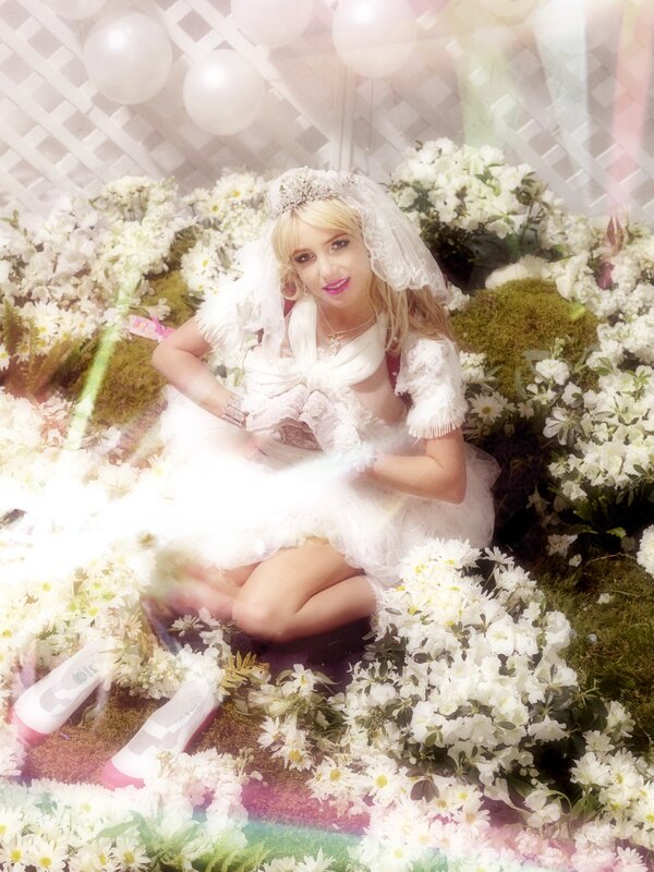 woman in wedding dress surrounded by flowers