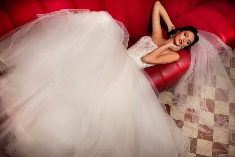 Woman in Wedding Dress — White, Dramatic, Photograph, Red Couch