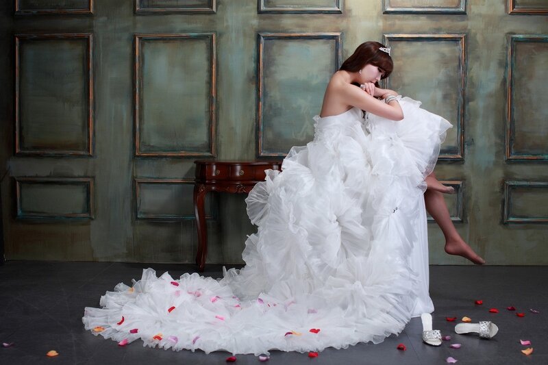Woman in Wedding Dress — White, Dramatic, Photograph, Table, Rose Petals