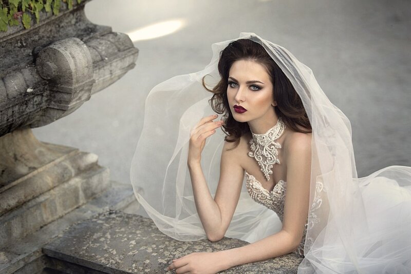 Woman in Wedding Dress — White, Dramatic, Photograph, Veil, Stone Structure