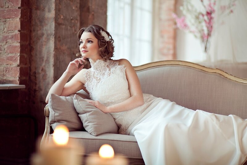Woman in Wedding Dress — White, Serene, Afternoon, Photograph, Couch, Pillows, Candles
