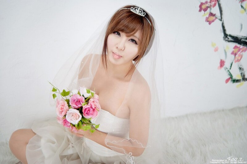 woman in wedding dress with bouquet