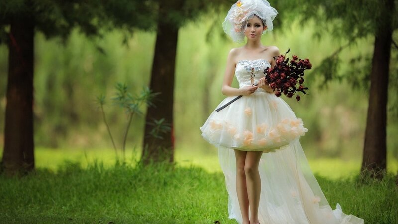 woman in wedding dress with bouquet