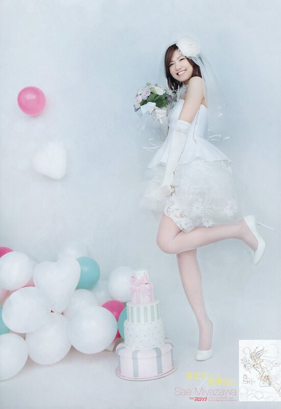 woman in wedding dress with cake